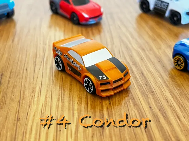 A carousel photo displaying the fourth vehicle named 'Condor' out of an array of 'Standard cars', at full size. The car is painted orange with the number 73 and graffiti printed