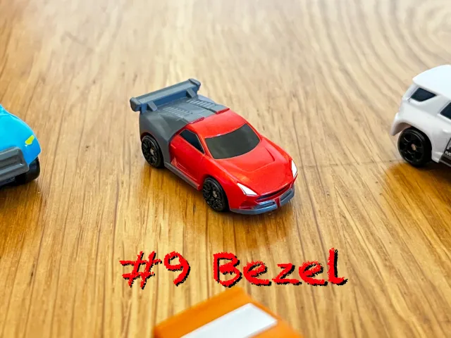 A carousel photo displaying the ninth vehicle named 'Bezel' out of an array of 'Standard cars', at full size. The car is painted red with the back pained black.