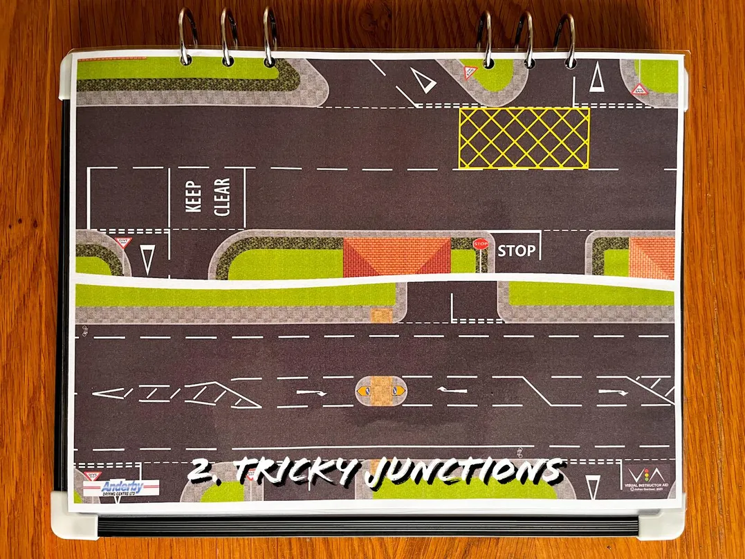 A carousel photo displaying the second plan named 'tricky junctions' out of an array of roads layouts, at full size. Consisting of two/half-designs with their own junctions like a keep clear road marker.
