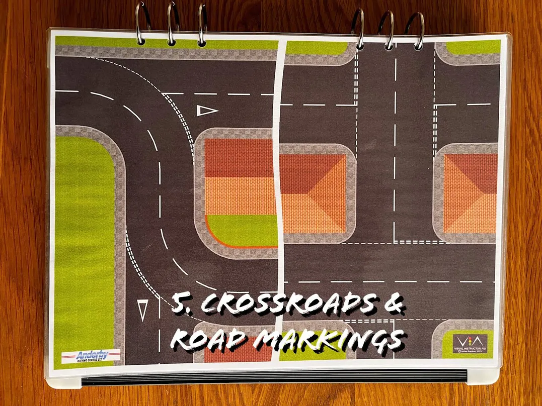 A carousel photo displaying the fifth plan named 'crossroads & road markings' out of an array of roads layouts, at full size. Consisting of multiple crossroads and give-way road markings.