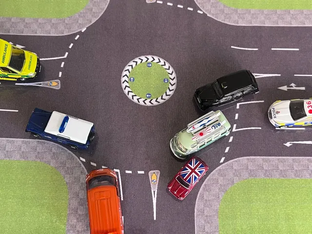 Two vehicles entering a multi-lane roundabout demonstrated on appropriate road layout.