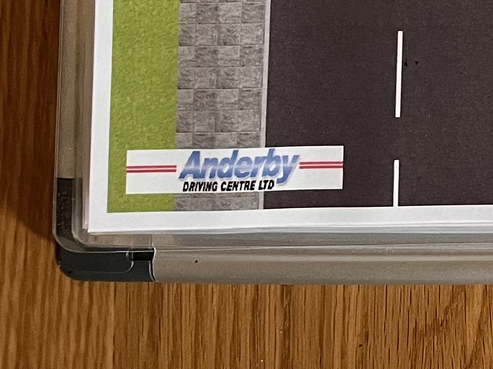 A photo demonstrating a personalized road layout by applying your own logo etc., For example, bottom-left corner states 'Anderby driving centre LTD'.